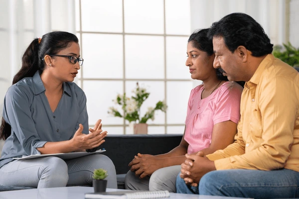 indian psychologist advising middle aged 600nw 2368780783